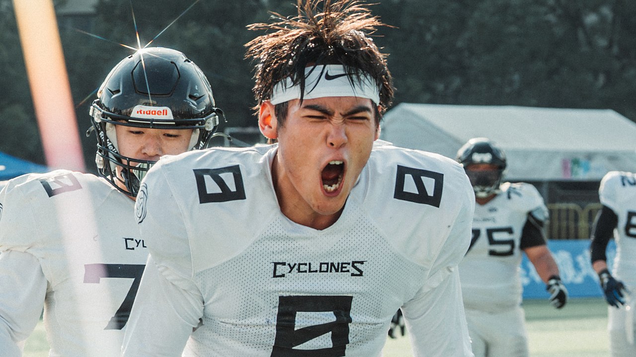 Adam Zhang celebrating with a Beijing Cyclones teammate