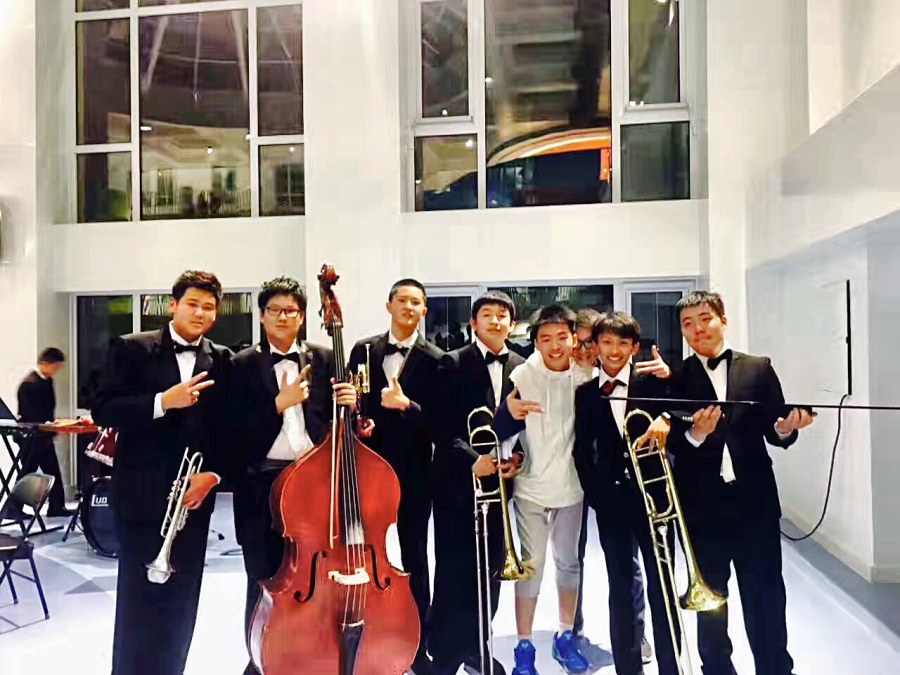 Adam Zhang with his middle-school wind band after the graduation concert