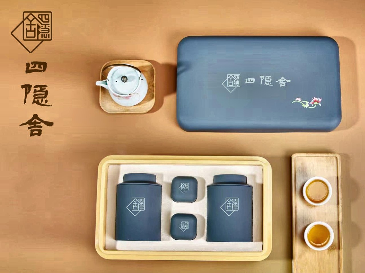The Siyinshe Fenghuang Dancong gift set laid out with a teapot, tins and cups